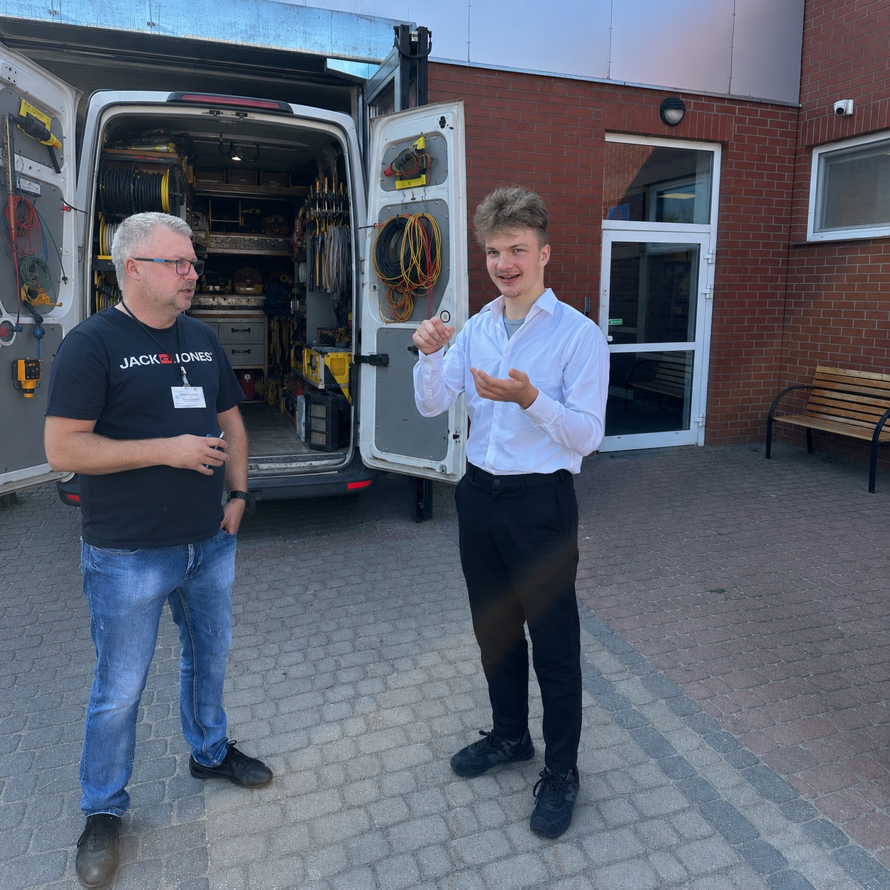 Robert on-site at a factory, walking a technician through how STORMY runs the shop